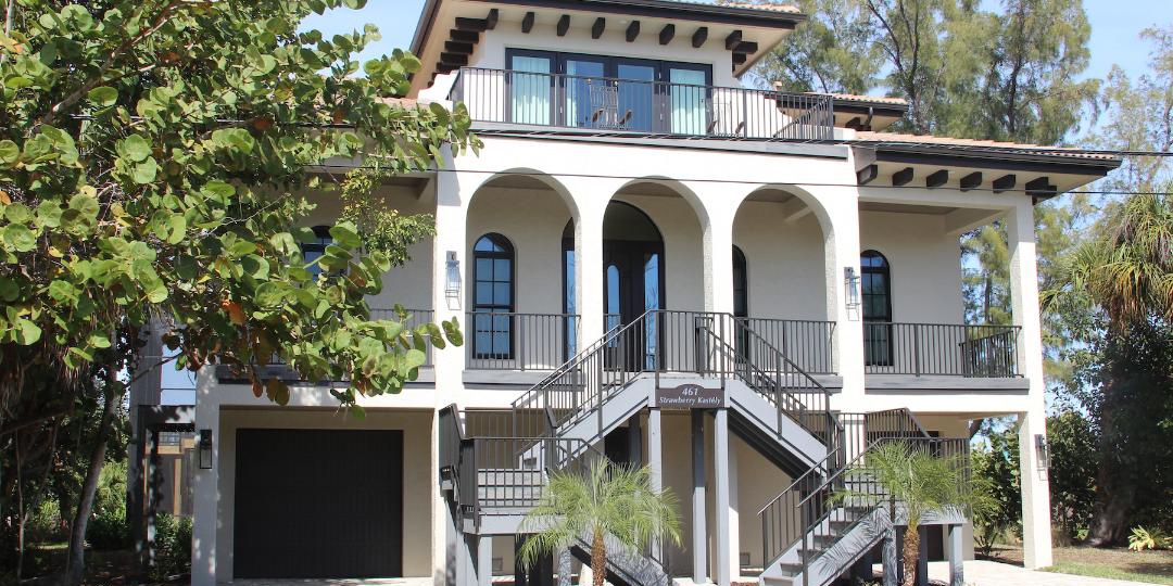 Mediterranean “castle” with its commanding lake view from all rear windows