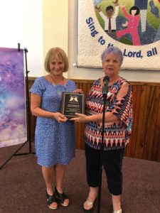From left, Zonta co-liaison Erika Steiner receives a plaque of appreciation from Dr. Helen Gierke, President of Angel Wings of SW Florida, Inc.